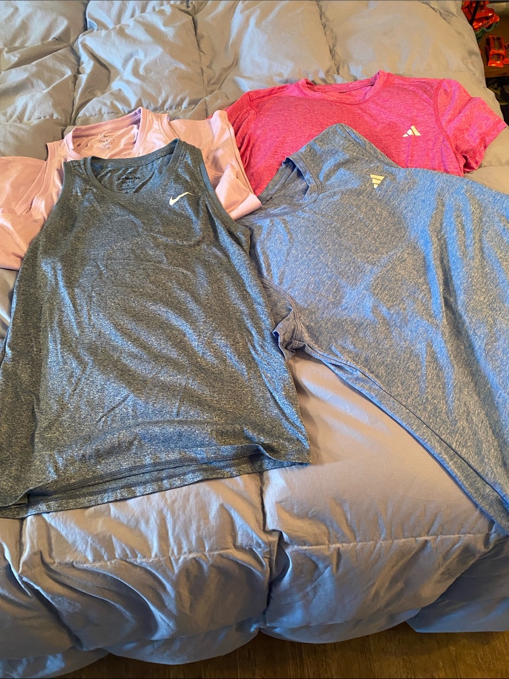 Nike and Reebok Women’s athletic shirts as shown bundle